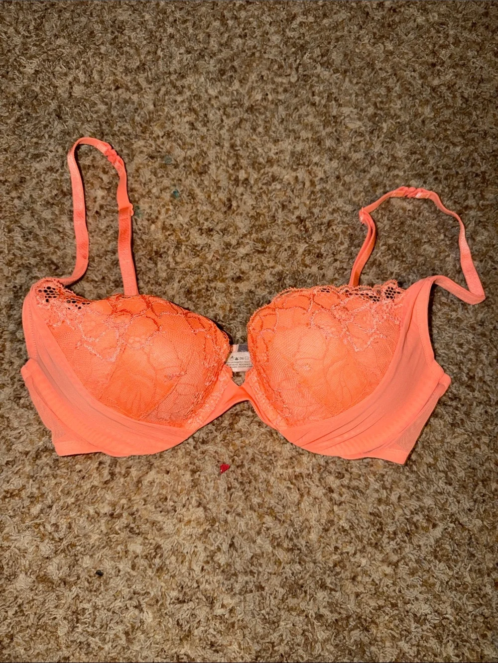 Bright orange Victoria’s Secret “Padded Demi” bra